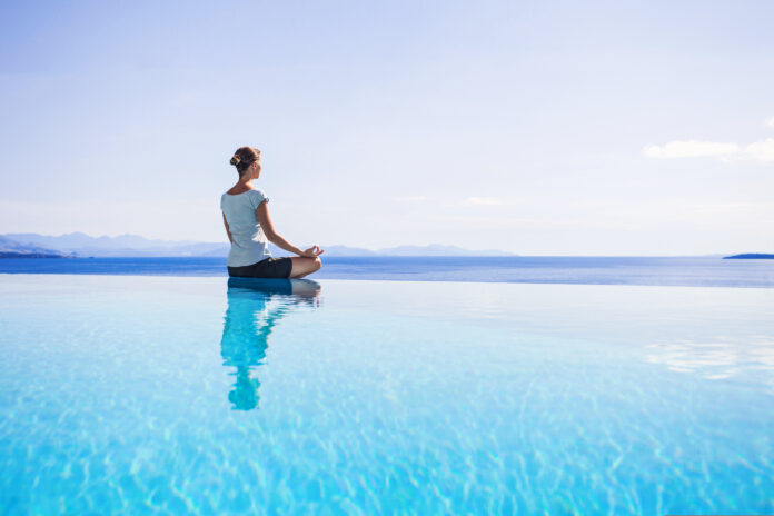 Young,Woman,Meditating,Outdoors.,Yoga,Exercises.,Women,Yoga.,Healthy,Lifestyle